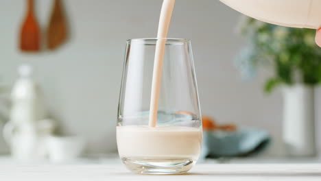 pouring milk into a glass