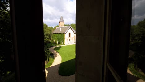 peering through the window, the view unfolds onto a scene of timeless beauty, showcasing the rich tapestry of france's traditionally built architectural heritage