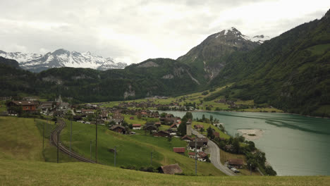 panoramic scenery of lake lungern with old rural village and mountains