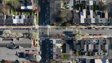 Straight-street-of-american-city-with-town-houses-during-sunny-day