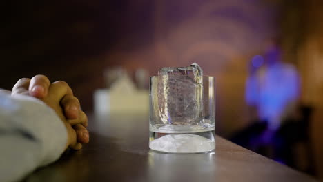 bartender serving whisky