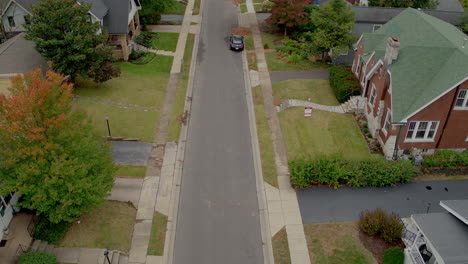 overhead view of suburban street with a tilt up to the horizon