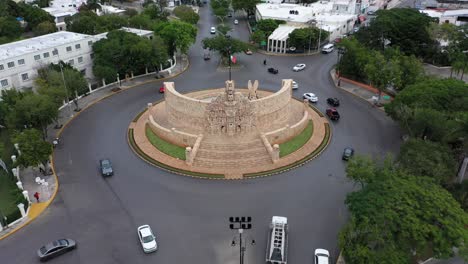 aerial pull back from the monument a la patria, homeland monument on the paseo de montejo in merida, yucatan, mexico