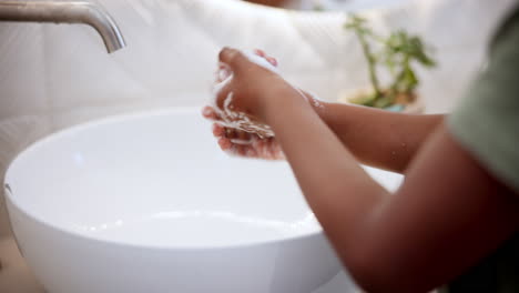 person, hands and wash soap in sink for clean