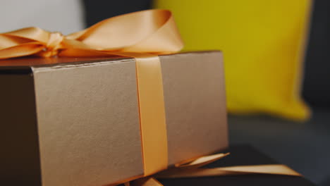 close up of gift wrapped presents on table in lounge at home 3