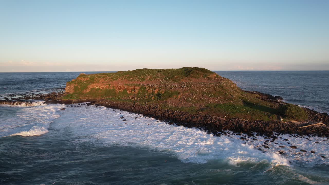 Island with Waves and Rocky Coastline