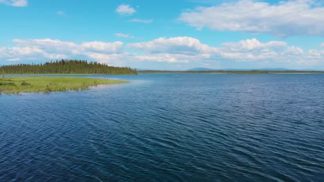 4k drone video of kayaker on clearwater lake near delta junction, ak during summer