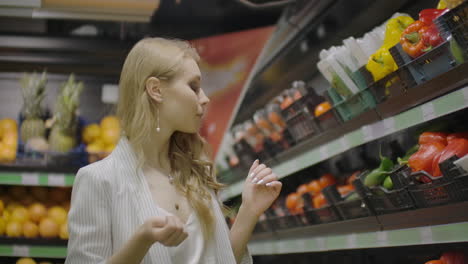 Hands-take-few-colorful-pepper-one-by-one-in-marketplace-and-hold.-Close-up-concept-of-selection-buy-quality-fruit-or-red-vegetables.-Young-woman-pick-up-some-tasty-freshness-ingredient-for-cooking