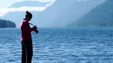 photographer at a scenic lake