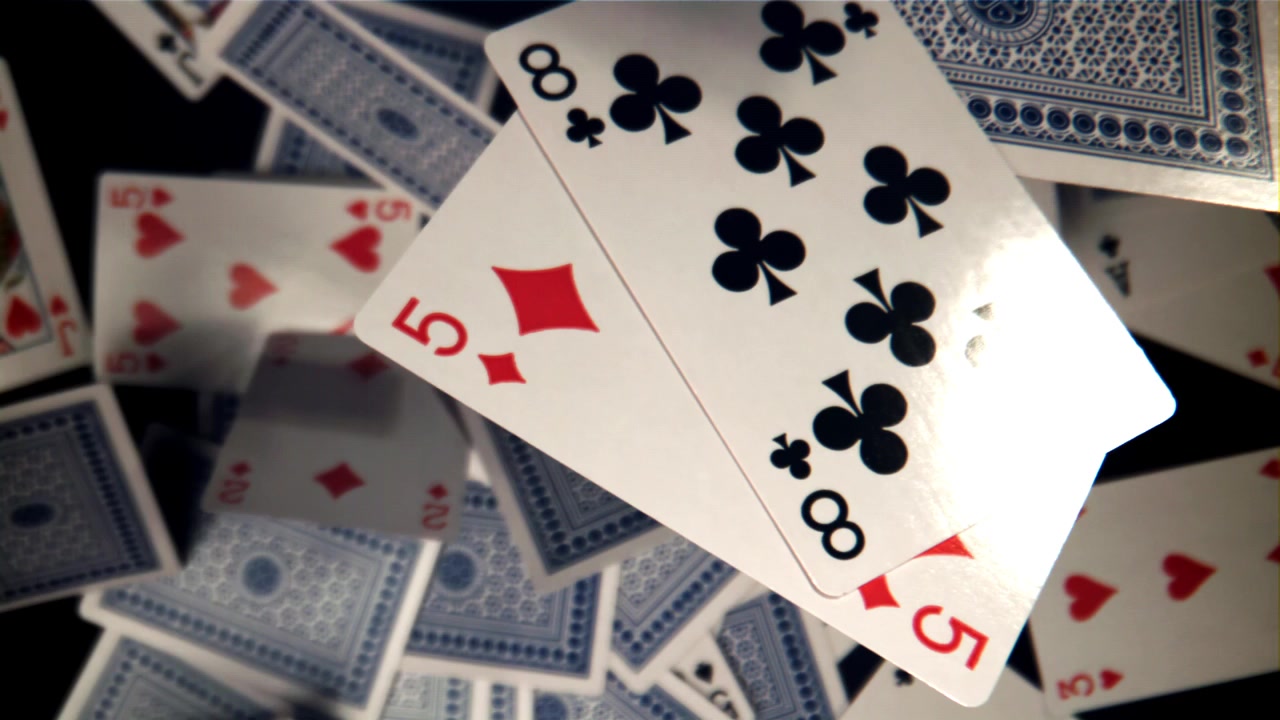 Playing Cards Falling and Scattering in Slow Motion