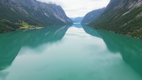 sunnfjord and turquoise blue jolstravatn lake in vestland, norway - aerial tilting up