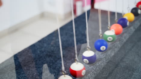Newton's cradle showing laws of physics in motion. Museum of Science