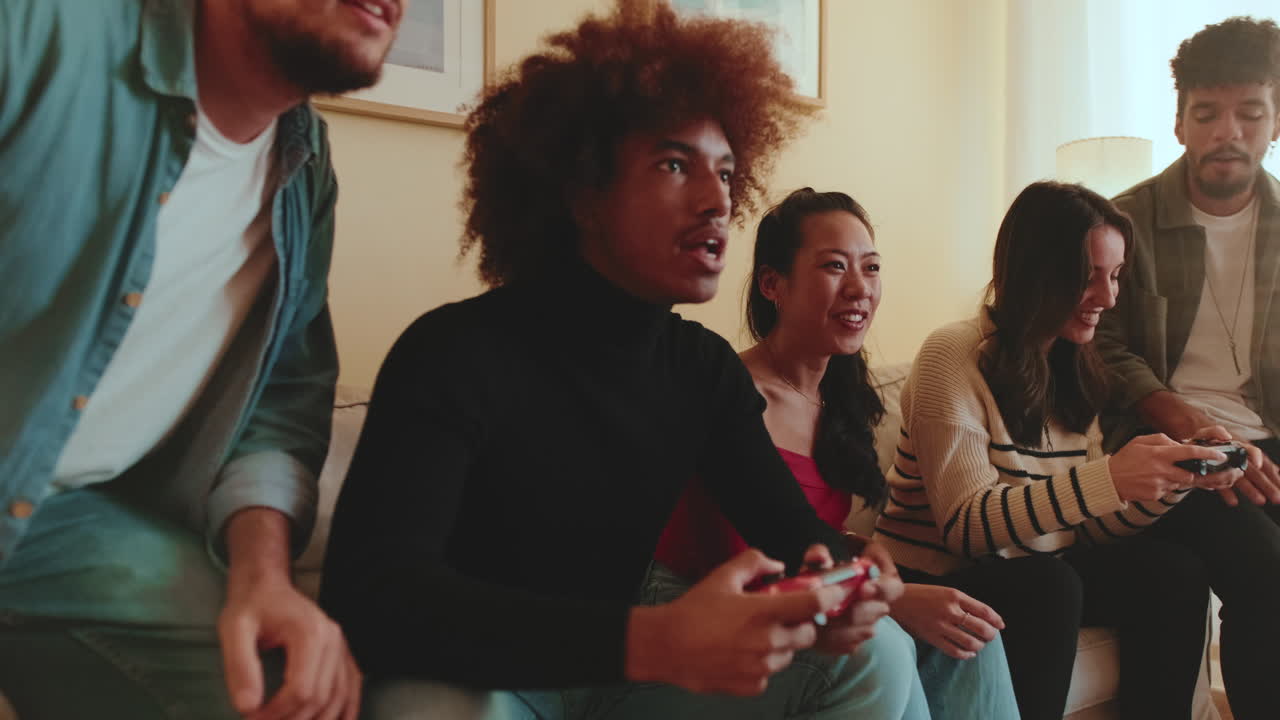 Group of friends playing video games together
