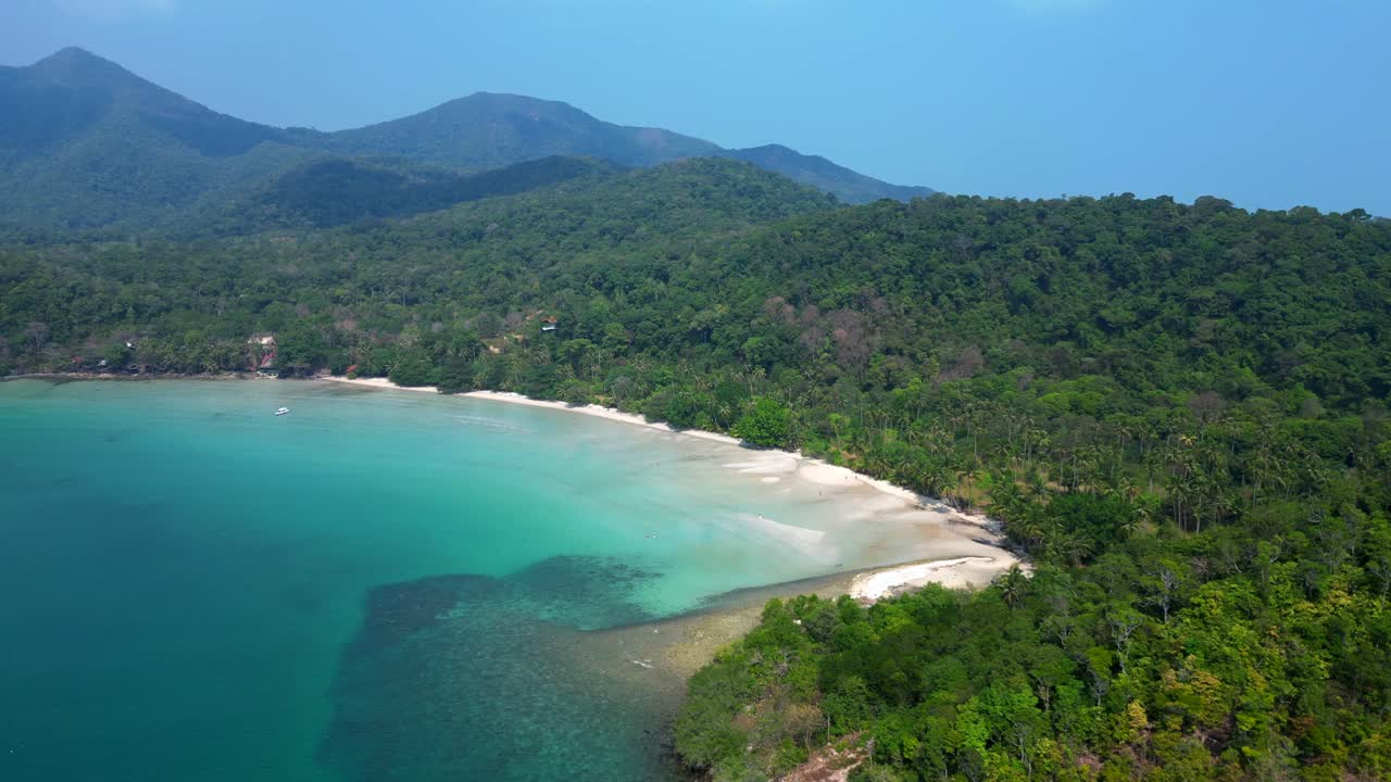 ong beach at koh chang island showing turquoise water and green rainforest in Trat Province, Thailand. Nice aerial view flight speed ramp hyper motion time lapse