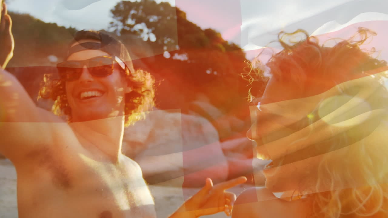 해변에서 즐겁게 지내는 친구 그룹 위에 잉글랜드의  ⁇ 발을 흔드는 애니메이션