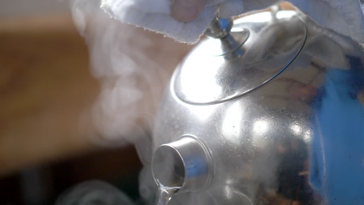 Pouring Hot Water from a Kettle
