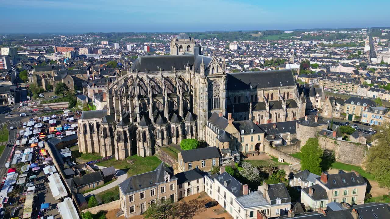 Historic city of Le Mans, with Cathedrale Saint-Julien, Marché des Jacobins and surrounding urban area, Sarthe, France. Aerial drone lateral view