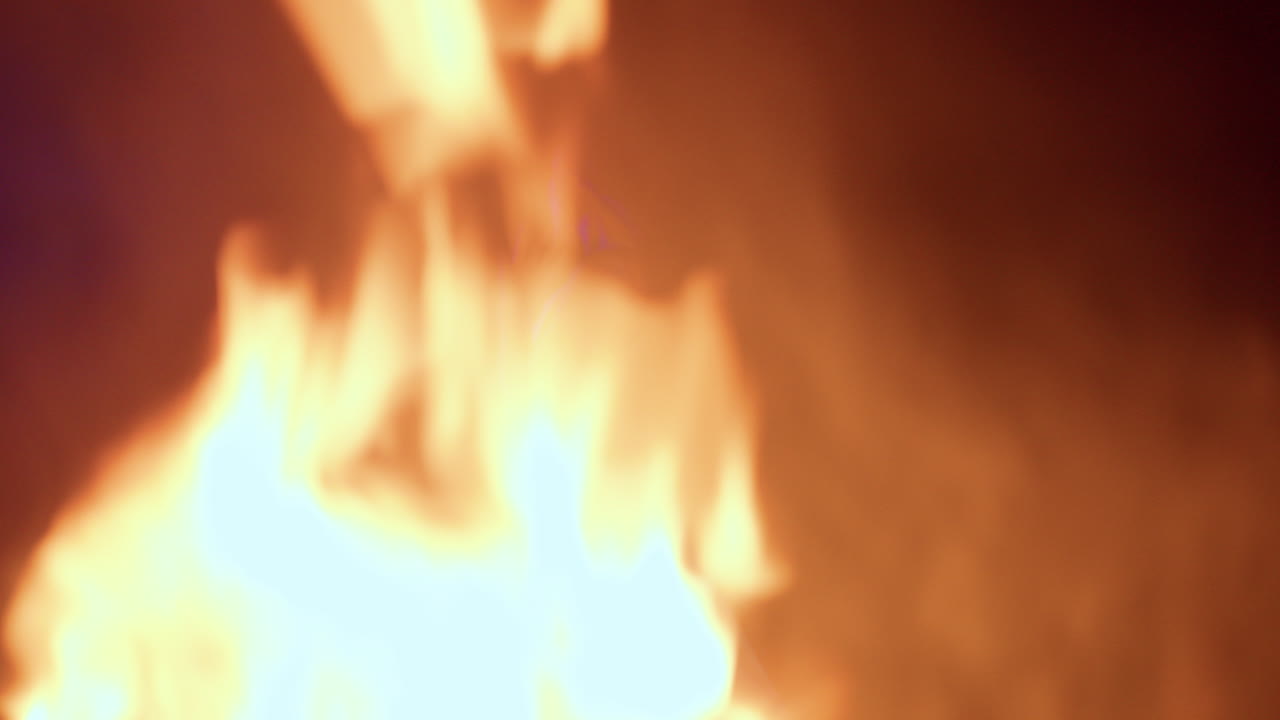 dancer performing at night in front at the fire dancing under the moon stars outdoor