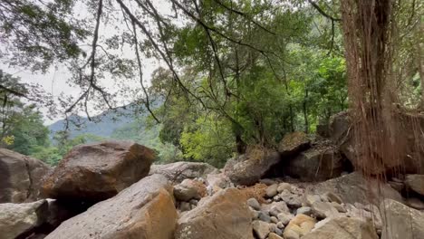 boulders on the river mountains of rainbow falls near tyrna village in india