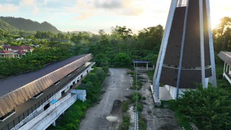 a church with a unique conical shape, a new building located on the border between indonesia and papua new guinea