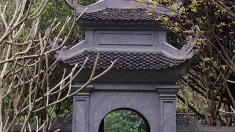 stone gate surrounded by nature and trees