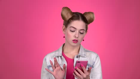 woman using a pink phone
