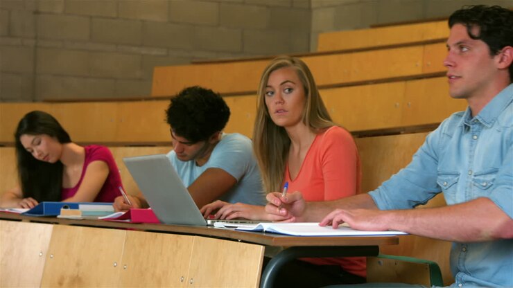 Students sitting beside each other while learning