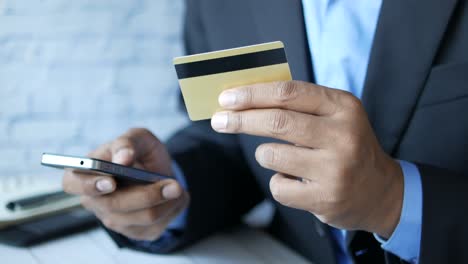 businessman making a mobile payment with credit card