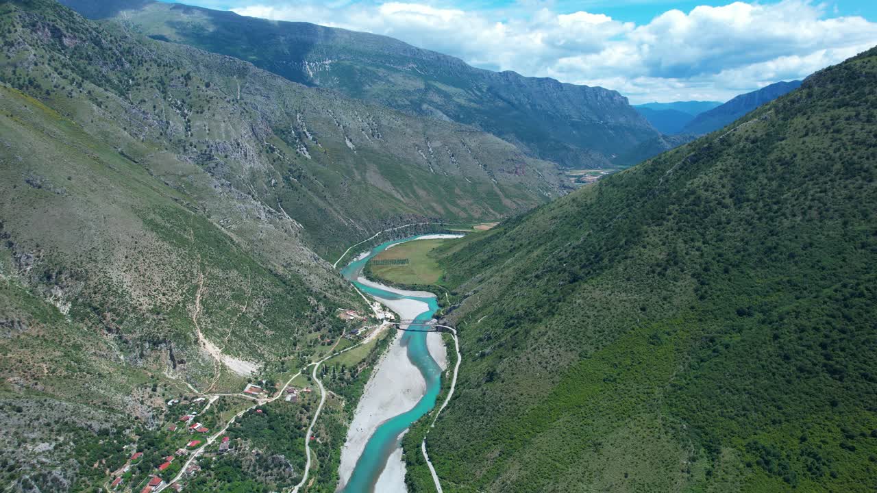 Vjosa Wild River Originating High in Mountains Flows Through Rocky Canyon with Aquamarine Spring Waters