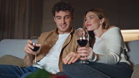 happy spouses enjoy date in romantic home atmosphere closeup. couple celebrating