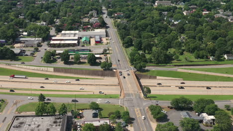 aerial view of highway and overpass car traffic by little rock city arkansas usa on sunny summer day, drone shot