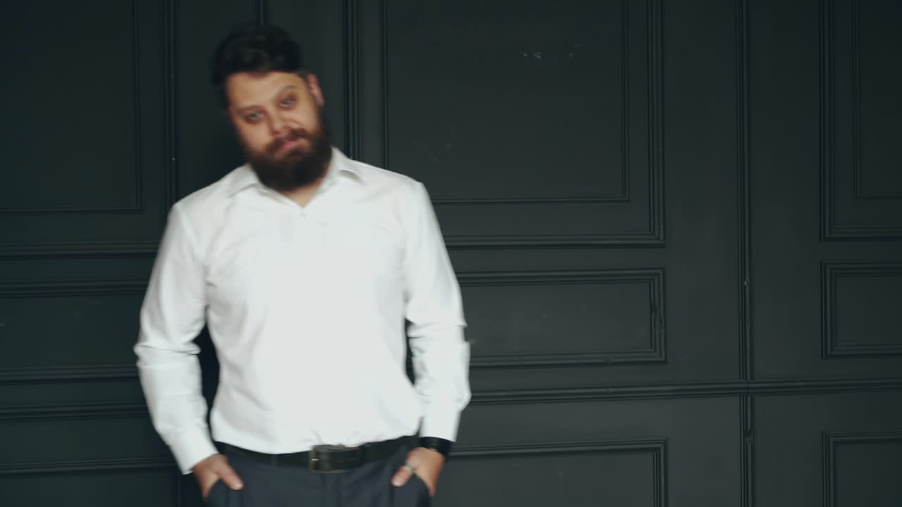 Young bearded man. Brutal caucasian serious handsome man in studio
