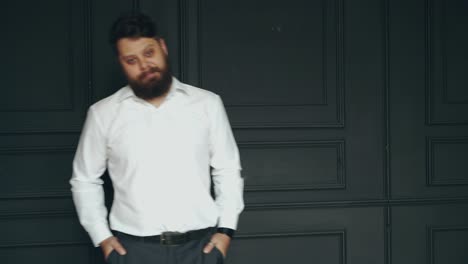 young bearded man. brutal caucasian serious handsome man in studio