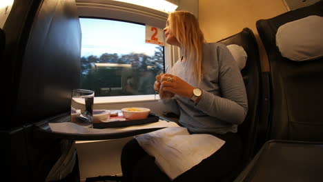 woman getting hungry during train trip