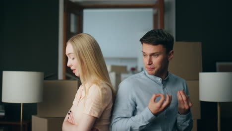 couple feeling communicating problem arguing at home closeup. woman ignoring man