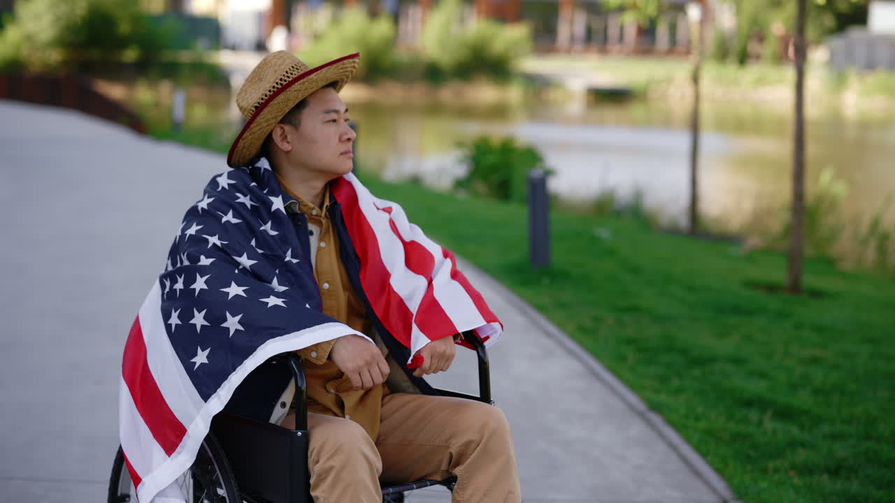 Man in Wheelchair with American Flag