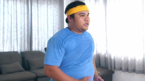overweight man exercising at home
