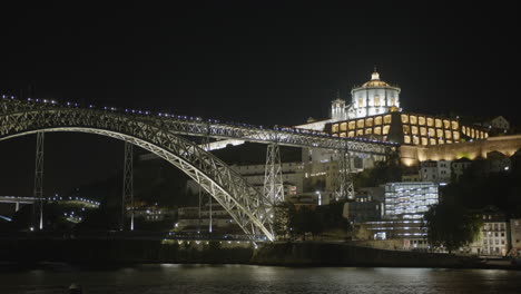 douro river bridge at night in porto, portugal