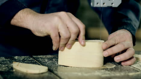 man cutting wood plank. carpenter at work. man cutting wood plank using electric jig saw.