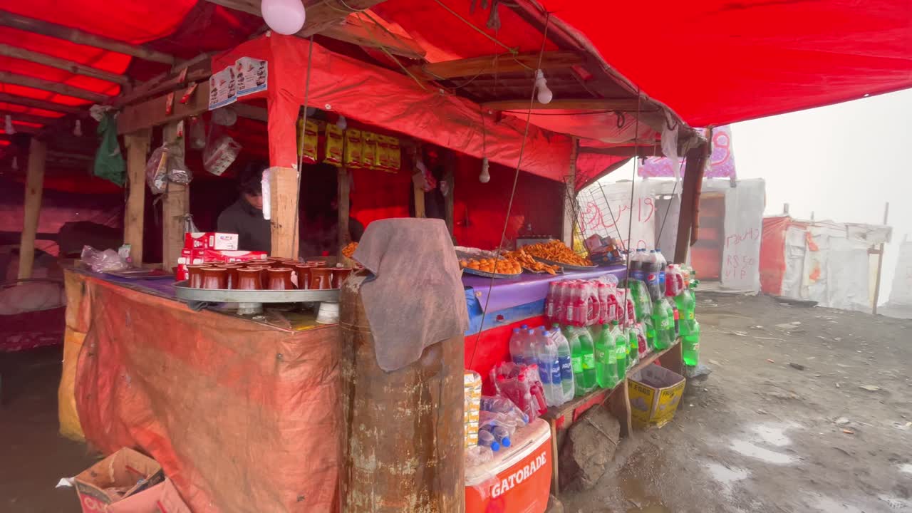Profile view of a local roadside food stall near Babusar Pass, Pakistan during daytime. Early morning.