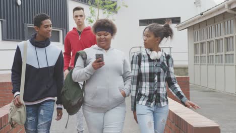 students walking in their high school grounds