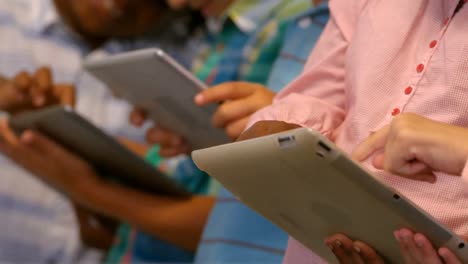 kids using digital tablet in classroom