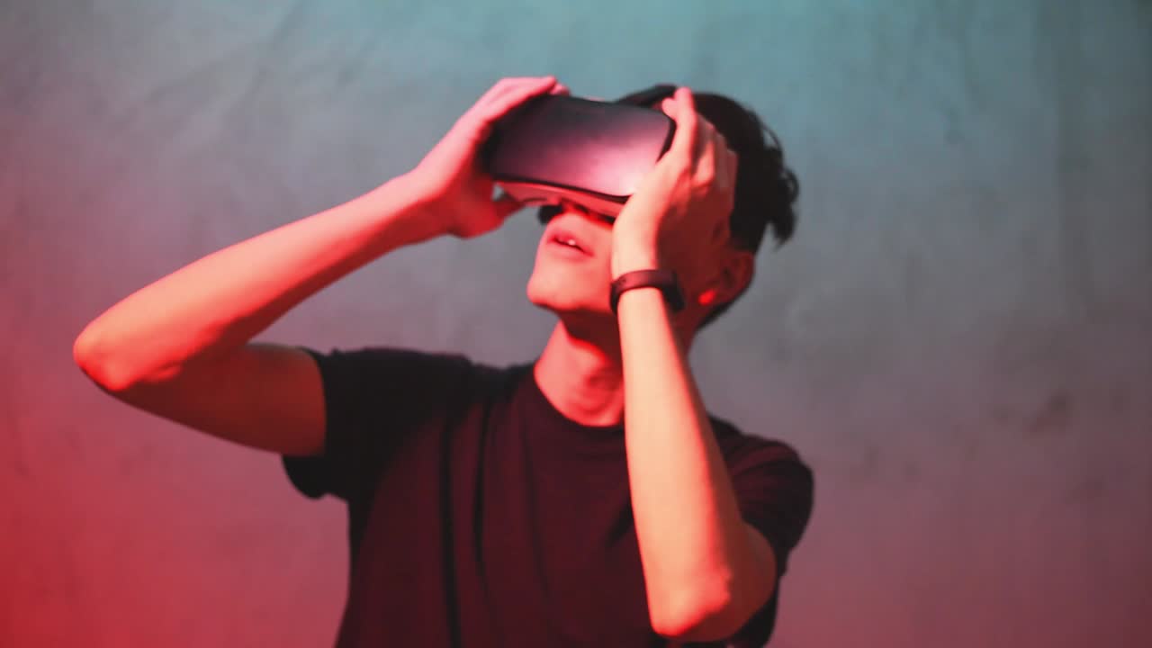 A boy who looks scared into a virtual reality with a colored background