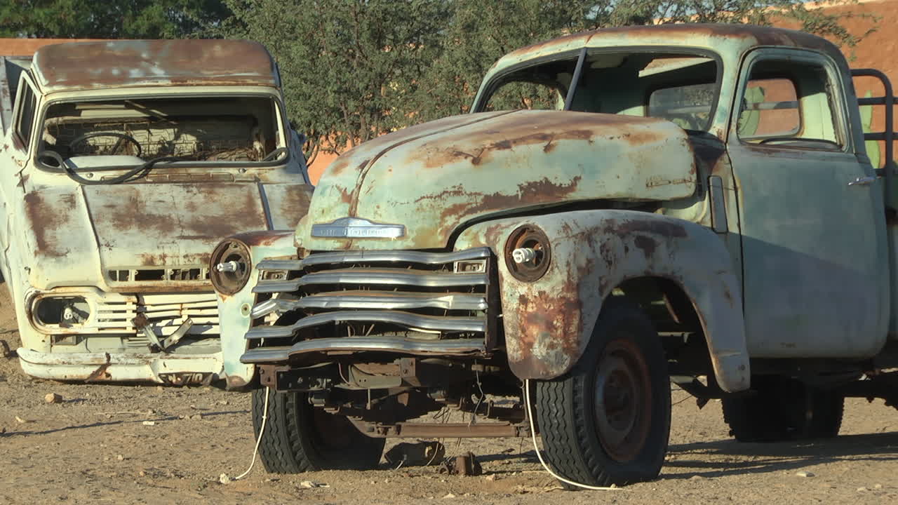 Vintage Old Rusty Abandoned Cars In The Desert. Locked Off