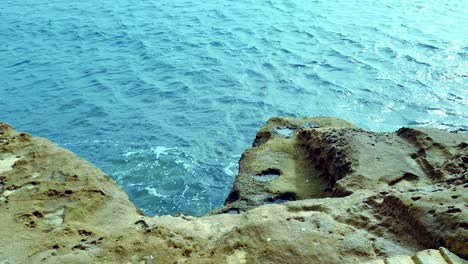 Calm-Waves-On-The-Rocky-Shore-Of-Tenerife,-Canary-Islands-In-Spain