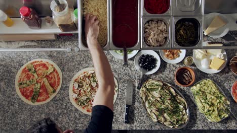 Preparing-vegetarian-pizza-in-restaurant-kitchen