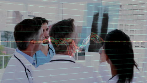 Medical team reviewing X-ray film in hospital corridor, showing gridlines and line chart overlay