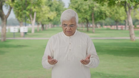 Indian-old-man-getting-a-surprise-in-park