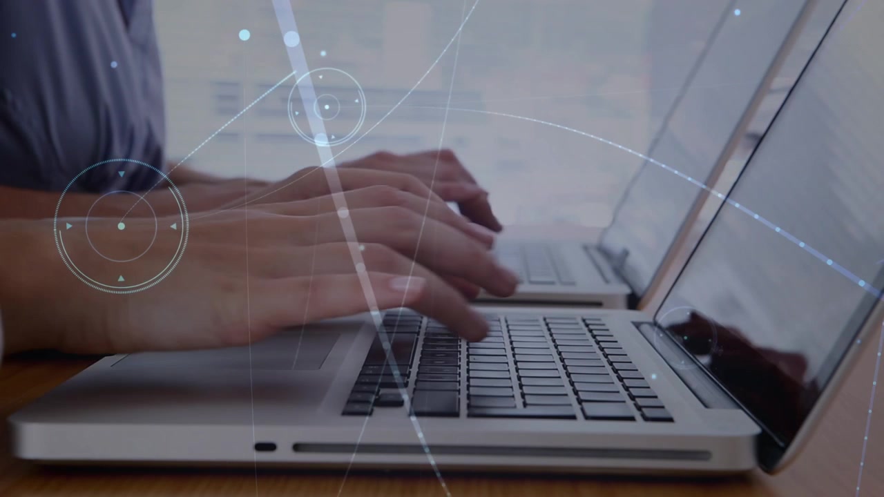 Animation of data processing over caucasian business people using laptops