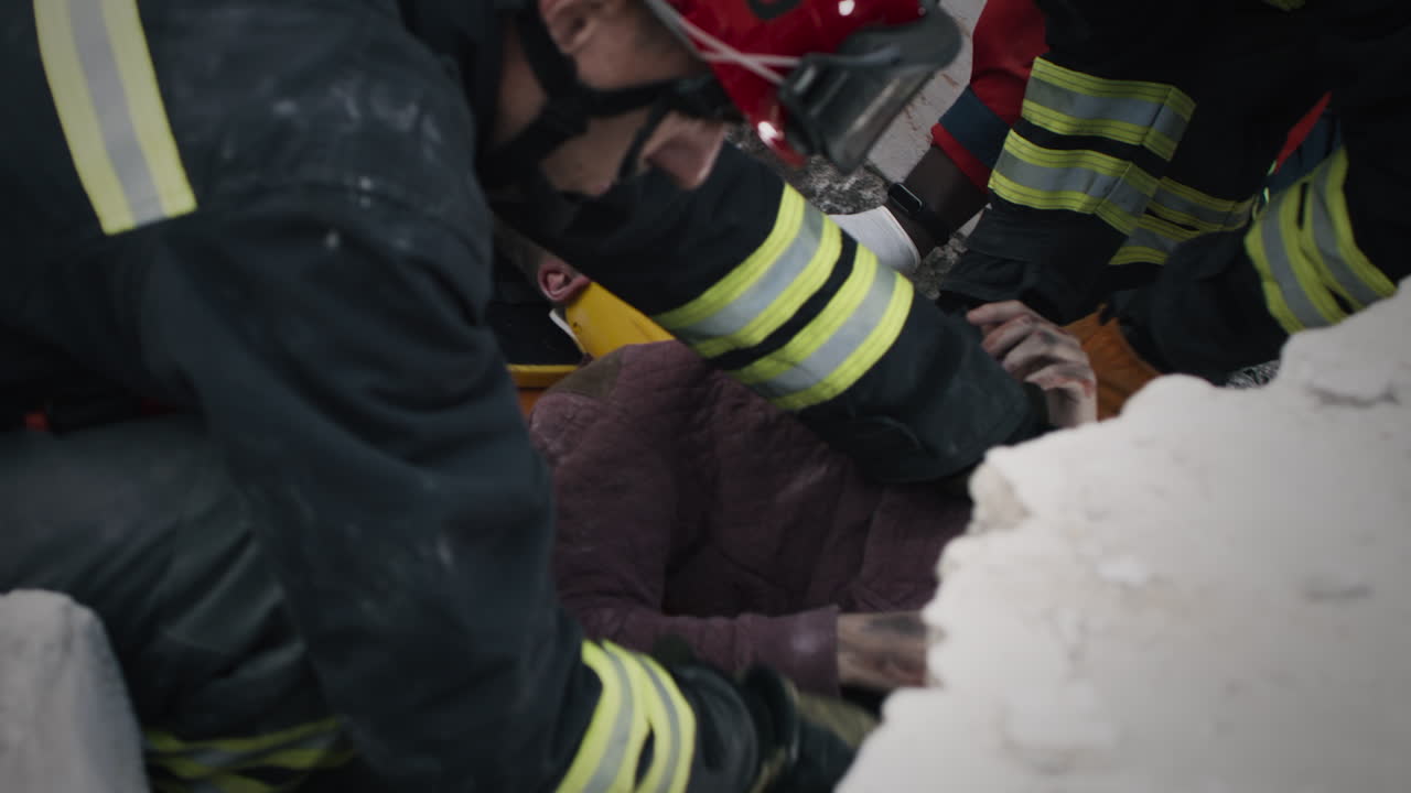 Firefighters Rescuing Injured Person